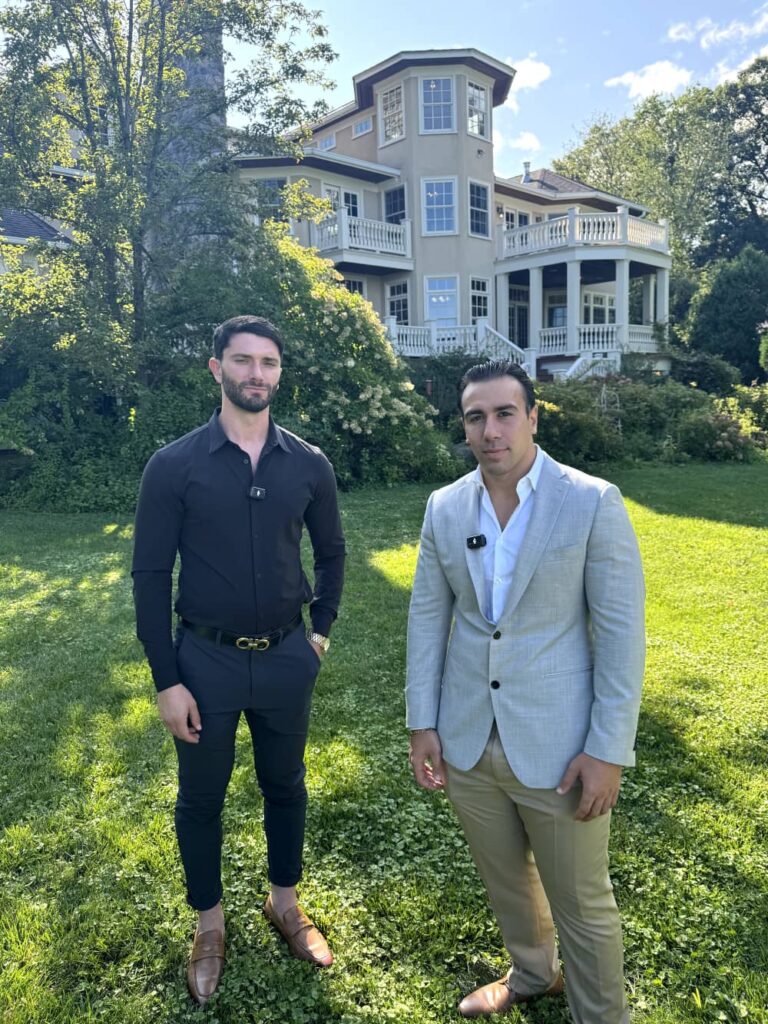 GT Luxury Group team members outside a home